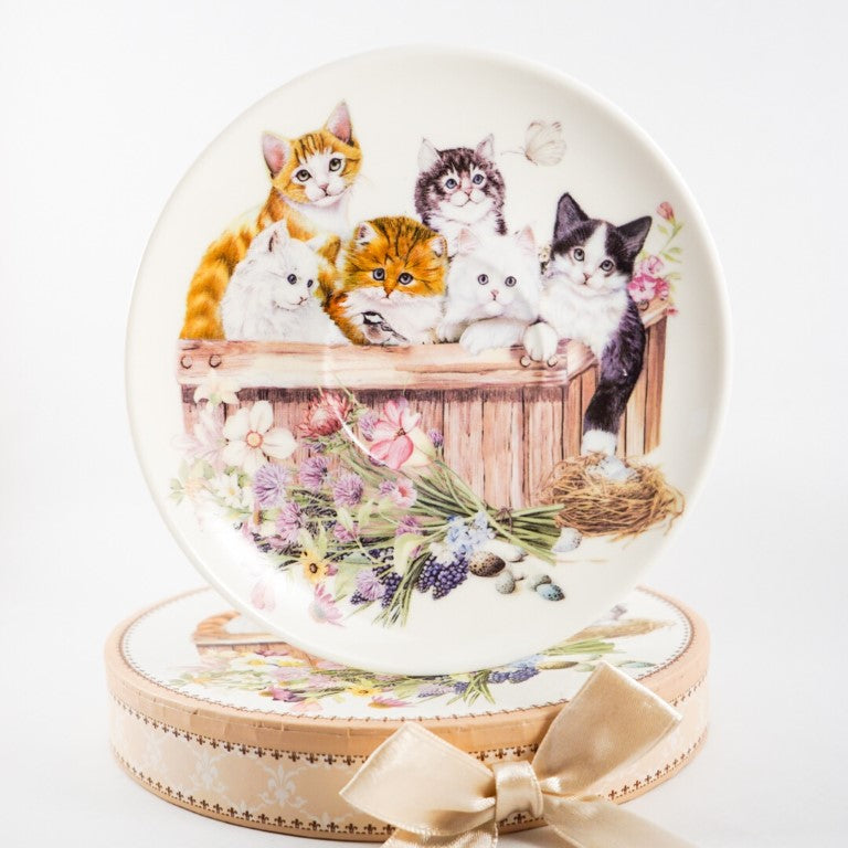 Full print of six cute kittens in a crate with flowers decoration on the saucer.