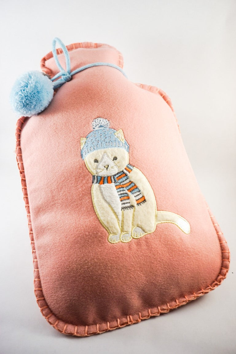 A medium size hot water bottle covered with a soft pink flannel material.