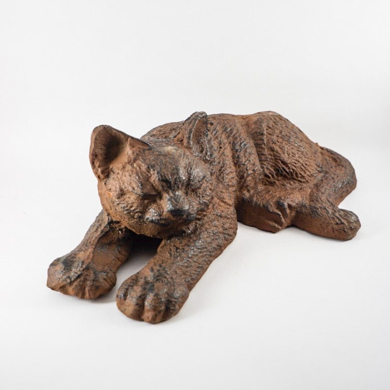 Made out of cast iron, weight is sufficient for a doorstop.