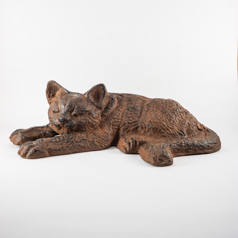 Cat figure imitating a peaceful sleeping cat.