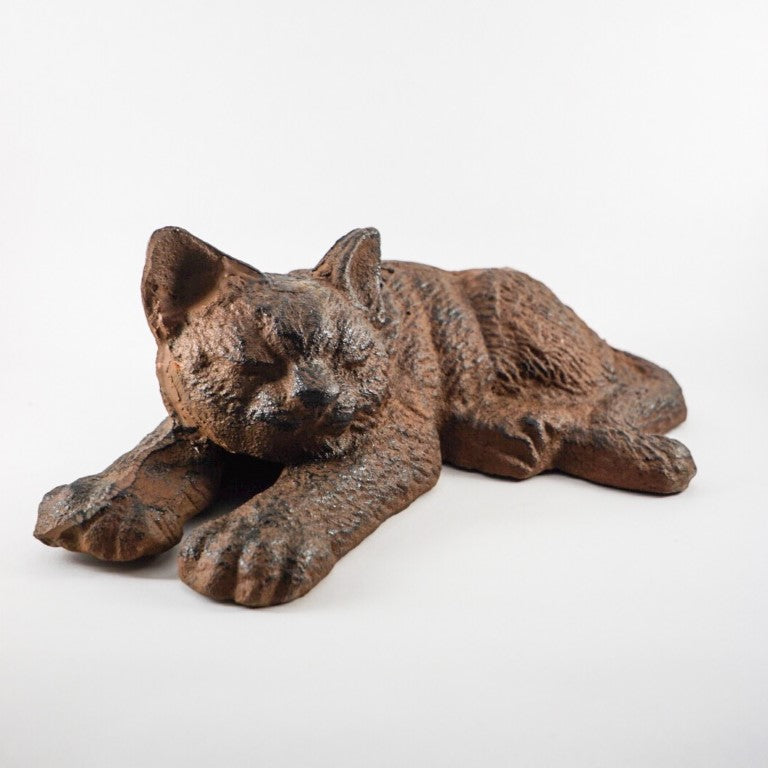 Made out of cast iron, weight is sufficient for a doorstop.